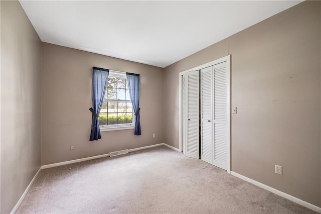 561 SW County Road O, Holden, MO 64040 - unfurnished bedroom featuring a closet and carpet flooring