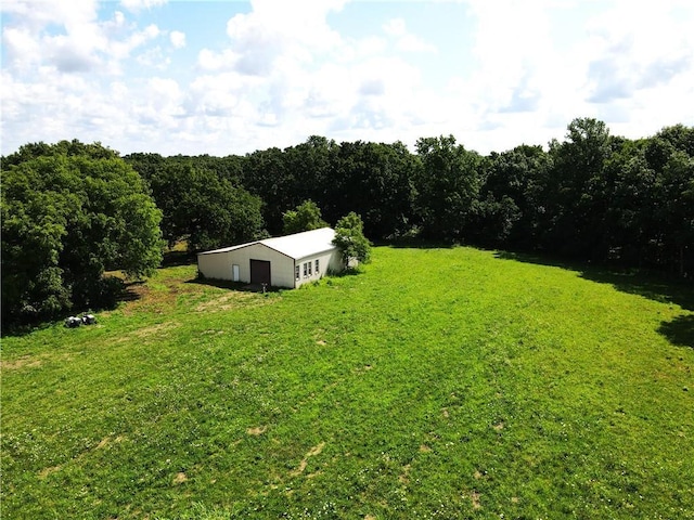 561 SW County Road O, Holden, MO 64040 - view of grassy yard with a pole building, an outbuilding, and a detached garage