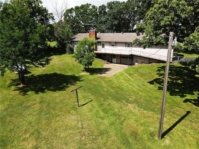 561 SW County Road O, Holden, MO 64040 - view of green lawn with a deck