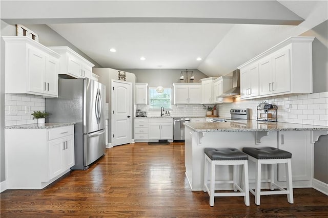 16728 Ruby Way, Basehor, KS 66007 - kitchen with a peninsula, tasteful backsplash, lofted ceiling, white cabinets, and recessed lighting