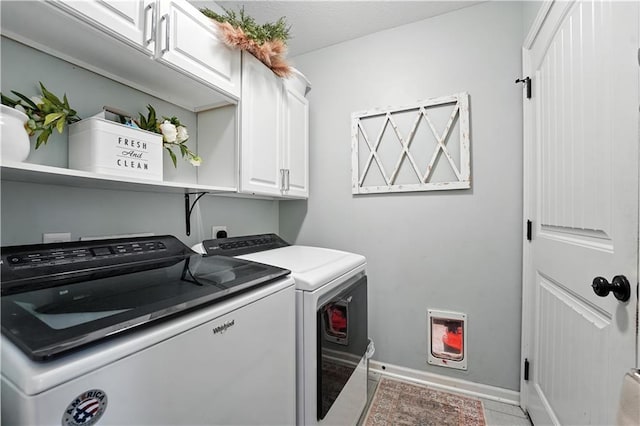 16728 Ruby Way, Basehor, KS 66007 - laundry area featuring cabinet space, washer and dryer, and light tile patterned floors