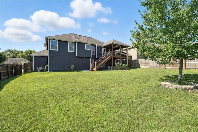 16728 Ruby Way, Basehor, KS 66007 - back of house with stairs, a fenced backyard, and a wooden deck
