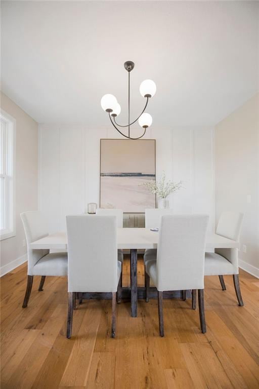 2416 W 177th St, Overland Park, KS 66085 - dining space featuring a chandelier and wood finished floors