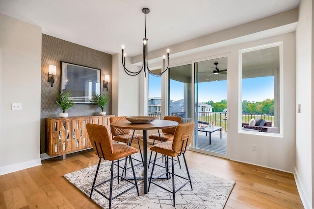 2416 W 177th St, Overland Park, KS 66085 - dining room featuring an accent wall, light wood-style floors, and ceiling fan