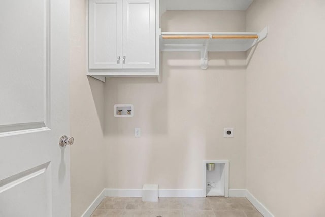 2416 W 177th St, Overland Park, KS 66085 - washroom with hookup for a washing machine, hookup for an electric dryer, cabinet space, and light tile patterned flooring
