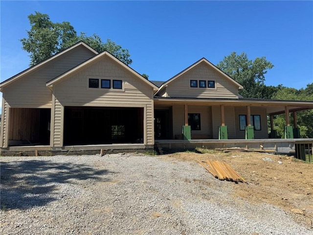 6130 S National Dr, Parkville, MO 64152 - view of front facade with a porch and an attached garage
