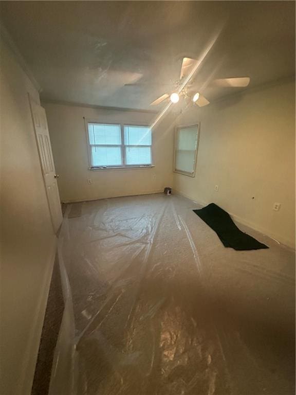 2209 E 72nd St, Kansas City, MO 64132 - unfurnished bedroom with ceiling fan and baseboards