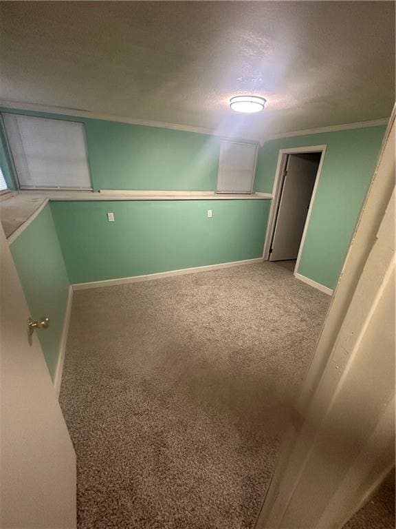 2209 E 72nd St, Kansas City, MO 64132 - carpeted spare room featuring baseboards and ornamental molding