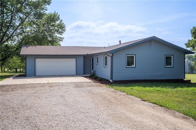 596 E 1732nd Rd, Baldwin City, KS 66006 - ranch-style house featuring driveway, an attached garage, and a front lawn