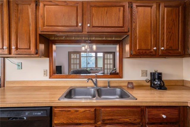 596 E 1732nd Rd, Baldwin City, KS 66006 - kitchen featuring black dishwasher, light countertops, and brown cabinets