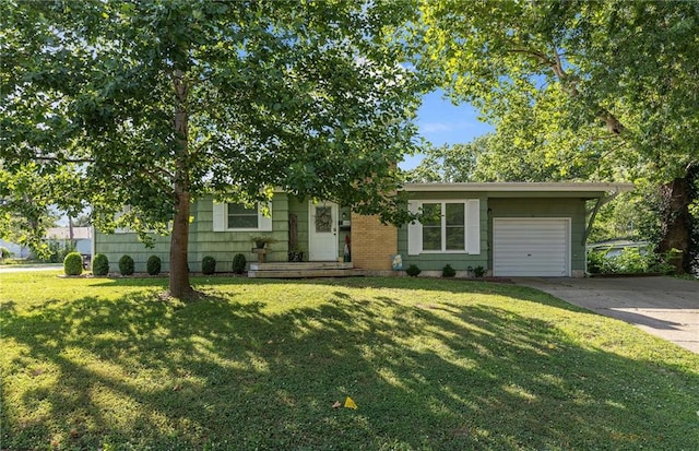 1101 Anderson St, Warrensburg, MO 64093 - view of front of house featuring an attached garage, concrete driveway, and a front yard