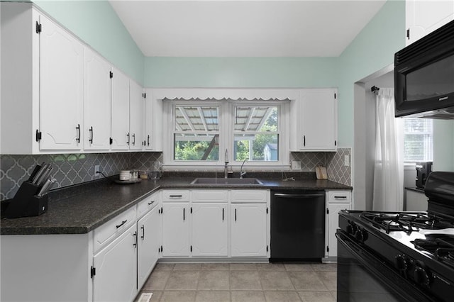 1101 Anderson St, Warrensburg, MO 64093 - kitchen featuring black appliances, white cabinets, dark countertops, and decorative backsplash