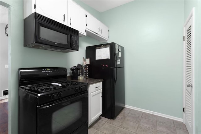 1101 Anderson St, Warrensburg, MO 64093 - kitchen featuring black appliances, dark countertops, white cabinetry, and light tile patterned floors