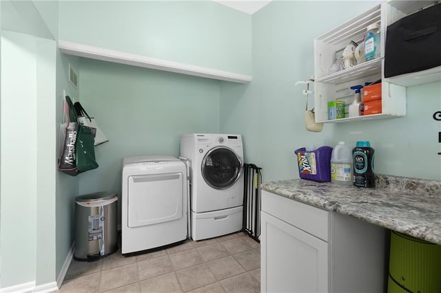 1101 Anderson St, Warrensburg, MO 64093 - laundry area featuring washer and dryer and light tile patterned floors
