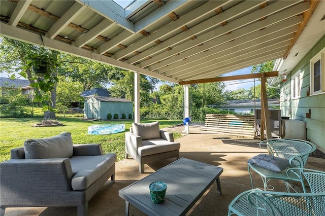 1101 Anderson St, Warrensburg, MO 64093 - view of patio / terrace with an outdoor hangout area and a shed