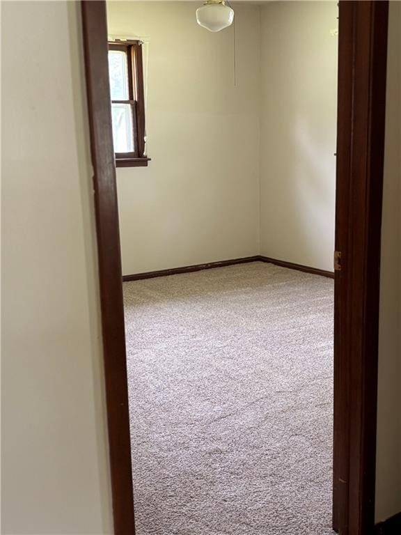 420 S Walnut St, Iola, KS 66749 - carpeted empty room with baseboards