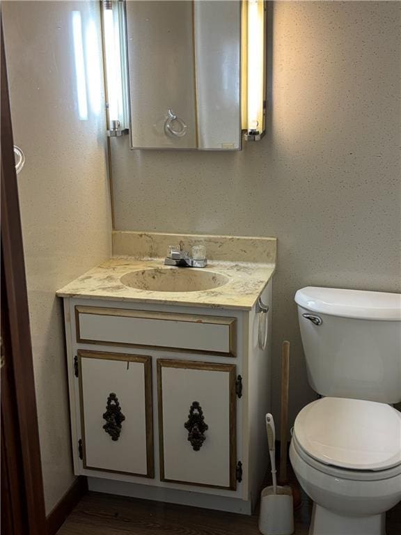 420 S Walnut St, Iola, KS 66749 - bathroom featuring vanity and toilet
