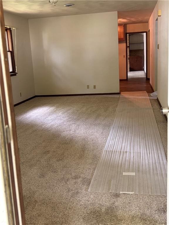 420 S Walnut St, Iola, KS 66749 - carpeted spare room featuring baseboards