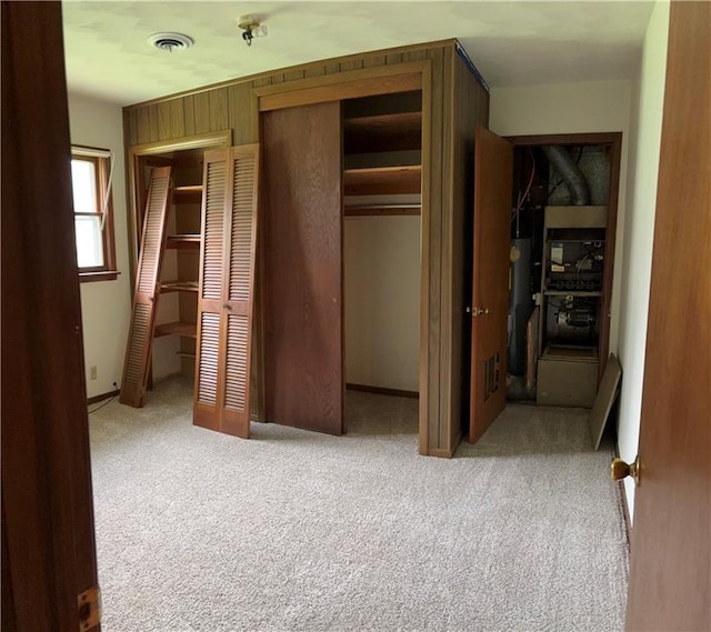 420 S Walnut St, Iola, KS 66749 - unfurnished bedroom with carpet and multiple closets