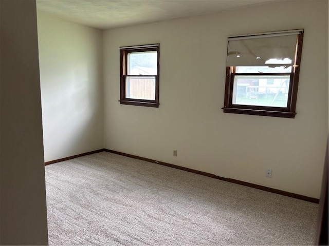 420 S Walnut St, Iola, KS 66749 - unfurnished room featuring carpet and baseboards