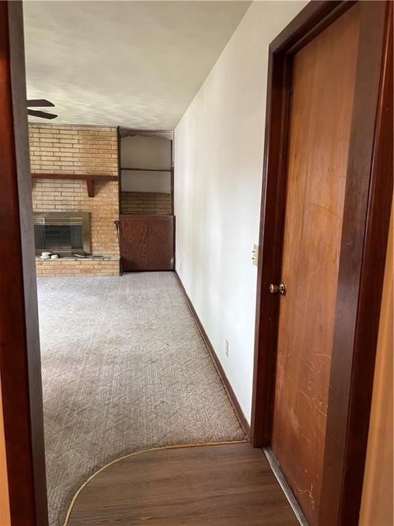 420 S Walnut St, Iola, KS 66749 - hallway with wood finished floors and carpet floors