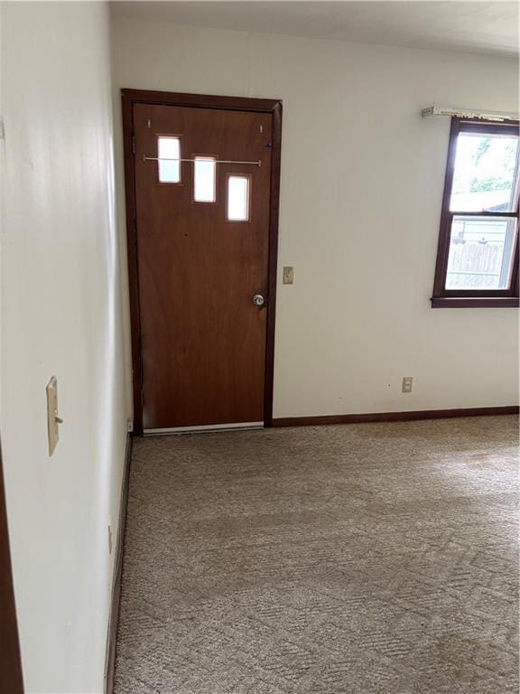 420 S Walnut St, Iola, KS 66749 - entrance foyer featuring carpet flooring and plenty of natural light
