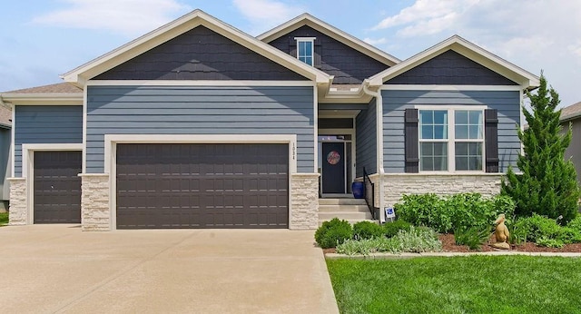 1034 SW Cheshire Dr, Lees Summit, MO 64083 - craftsman inspired home with stone siding, concrete driveway, a garage, and entry steps