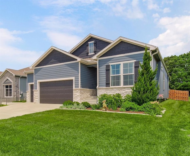 1034 SW Cheshire Dr, Lees Summit, MO 64083 - craftsman inspired home featuring an attached garage, stone siding, and concrete driveway