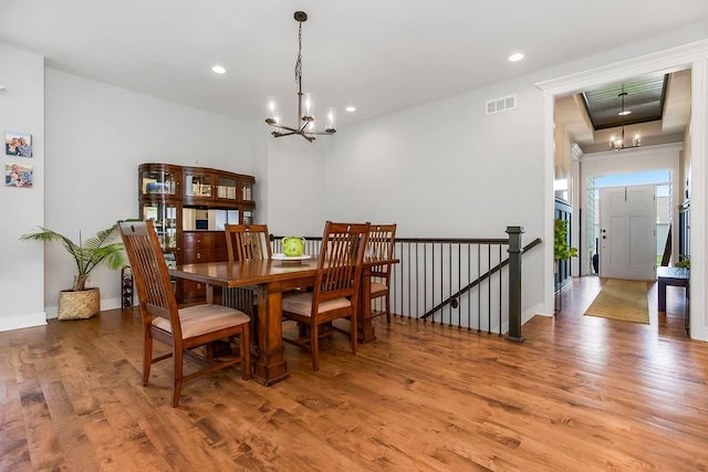 1034 SW Cheshire Dr, Lees Summit, MO 64083 - dining space with a chandelier, wood finished floors, and recessed lighting