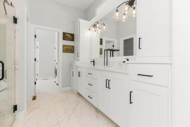 1034 SW Cheshire Dr, Lees Summit, MO 64083 - full bath featuring marble finish floors, double vanity, a marble finish shower, and a chandelier