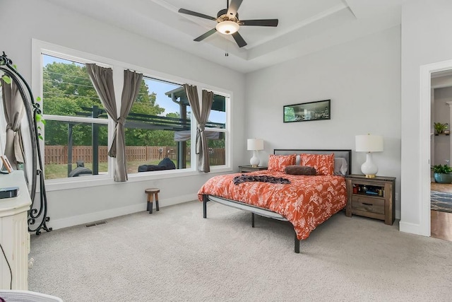 1034 SW Cheshire Dr, Lees Summit, MO 64083 - carpeted bedroom featuring a tray ceiling and ceiling fan