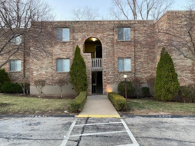 1848 E 97th St Unit C & D, Kansas City, MO 64131 - view of front of house featuring brick siding and uncovered parking