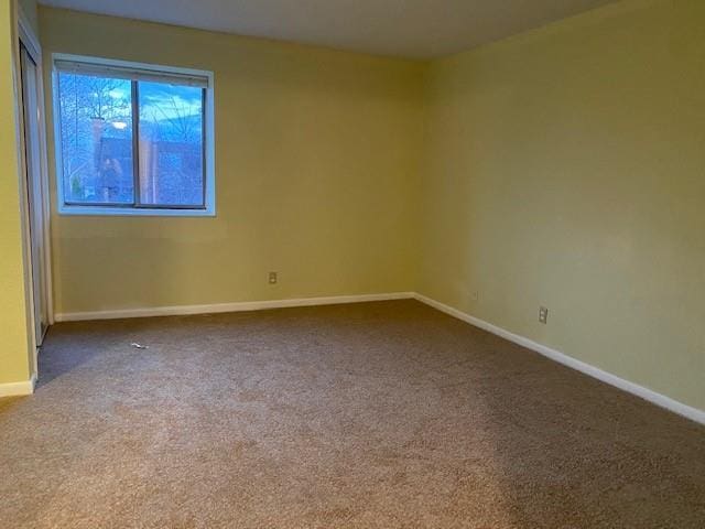 1848 E 97th St Unit C & D, Kansas City, MO 64131 - unfurnished room featuring baseboards and carpet flooring