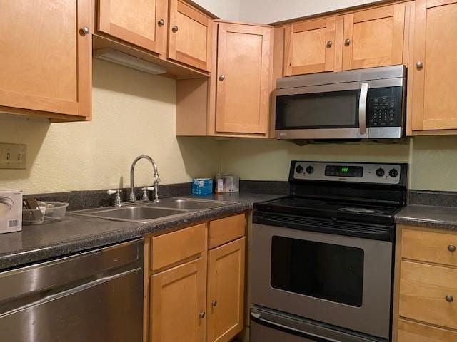 1848 E 97th St Unit C & D, Kansas City, MO 64131 - kitchen with appliances with stainless steel finishes and dark countertops