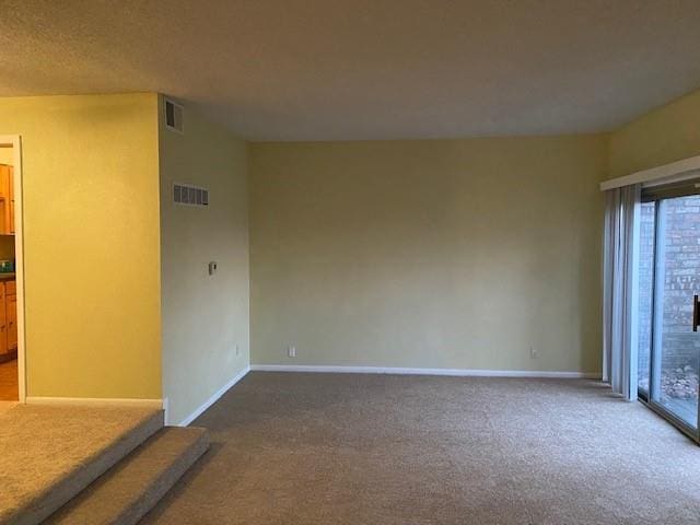 1848 E 97th St Unit C & D, Kansas City, MO 64131 - empty room featuring carpet floors and baseboards