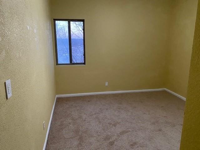 1848 E 97th St Unit C & D, Kansas City, MO 64131 - carpeted empty room featuring baseboards and a textured wall