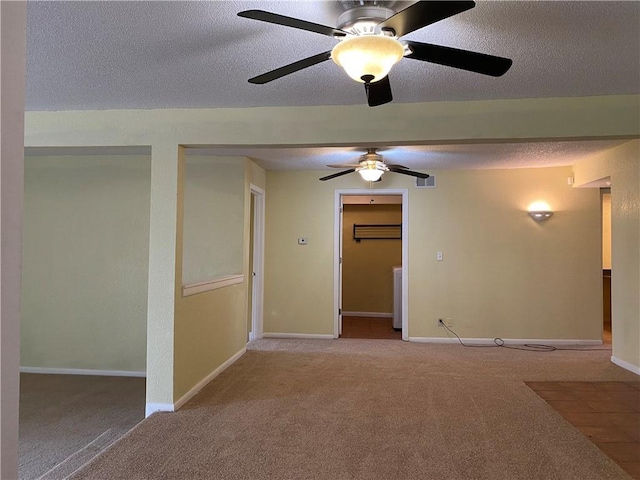 1848 E 97th St Unit C & D, Kansas City, MO 64131 - spare room with carpet floors, a ceiling fan, and a textured ceiling