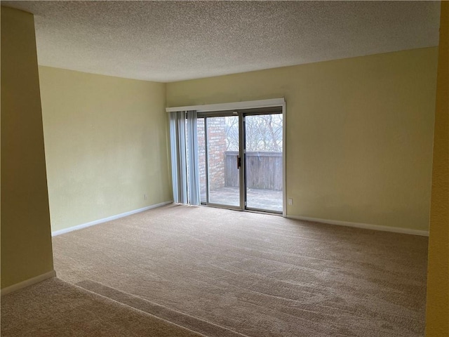 1848 E 97th St Unit C & D, Kansas City, MO 64131 - unfurnished room featuring carpet flooring and a textured ceiling
