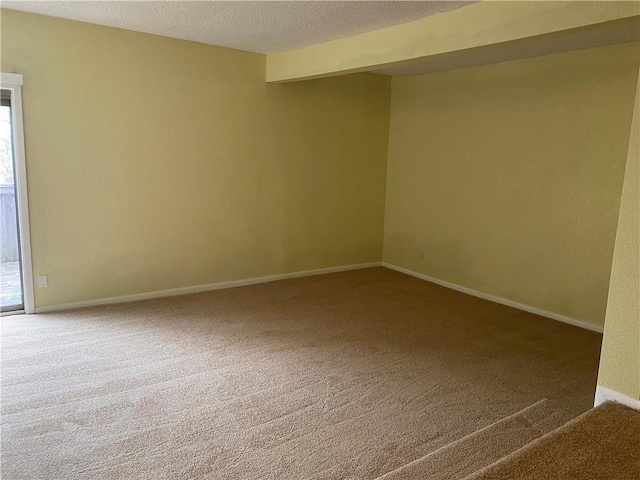 1848 E 97th St Unit C & D, Kansas City, MO 64131 - carpeted spare room with baseboards and a textured ceiling