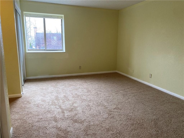 1848 E 97th St Unit C & D, Kansas City, MO 64131 - carpeted spare room with baseboards