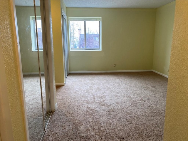 1848 E 97th St Unit C & D, Kansas City, MO 64131 - carpeted spare room with healthy amount of natural light and a textured wall