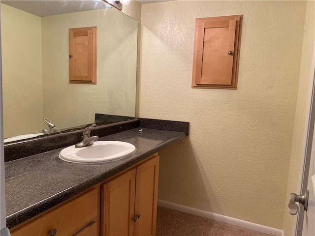 1848 E 97th St Unit C & D, Kansas City, MO 64131 - bathroom featuring vanity and baseboards