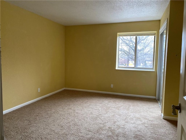 1848 E 97th St Unit C & D, Kansas City, MO 64131 - unfurnished room with carpet flooring and a textured ceiling