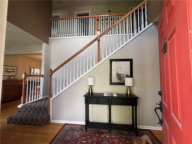 1840 W Fredrickson Cir, Olathe, KS 66061 - entryway with wood finished floors, stairway, and a towering ceiling
