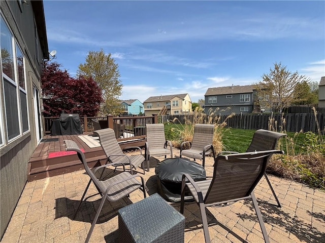 1840 W Fredrickson Cir, Olathe, KS 66061 - view of patio / terrace featuring a residential view, area for grilling, a wooden deck, and a fire pit