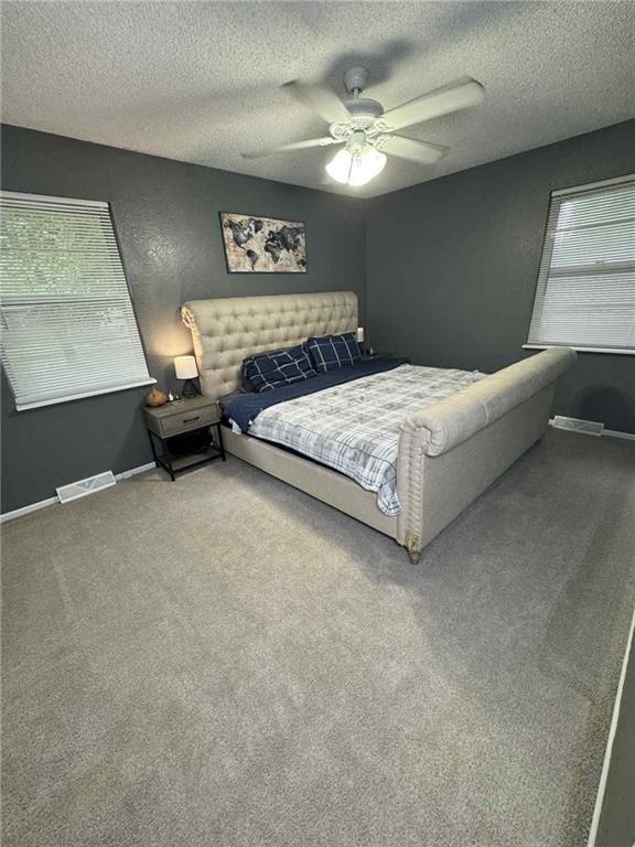 213 SW Palo Dr, Blue Springs, MO 64014 - bedroom featuring carpet floors, a textured ceiling, and ceiling fan