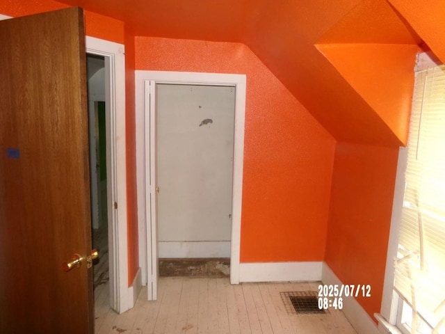 211 W Madison St, Yates Center, KS 66783 - bonus room featuring lofted ceiling and hardwood / wood-style floors