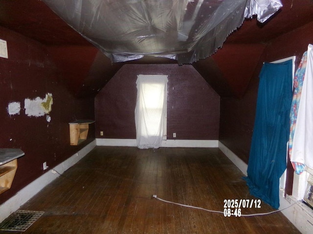 211 W Madison St, Yates Center, KS 66783 - additional living space featuring hardwood / wood-style floors and lofted ceiling