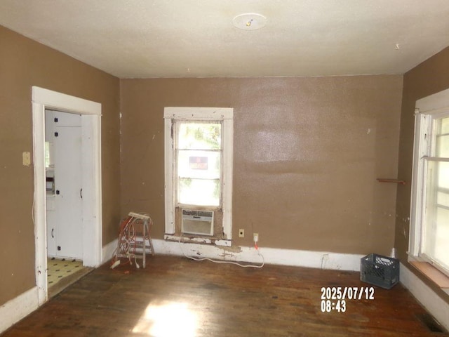 211 W Madison St, Yates Center, KS 66783 - spare room with wood finished floors and cooling unit