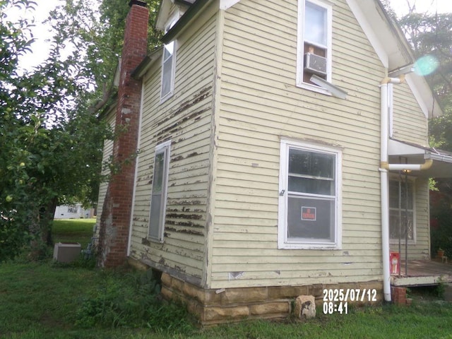 211 W Madison St, Yates Center, KS 66783 - view of side of home with a chimney